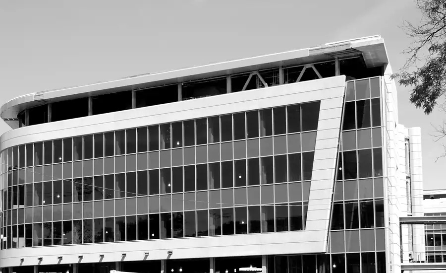 Modern multi-story commercial office building with a glass facade